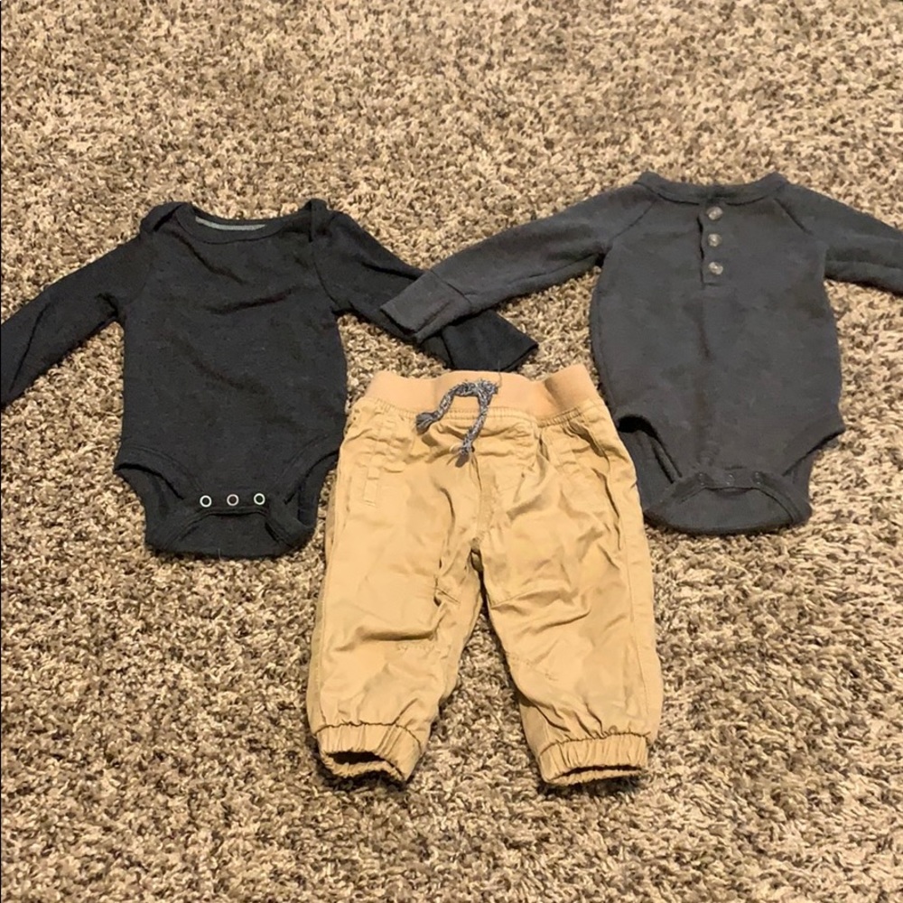 Two onesie long sleeve shirts and khaki pants